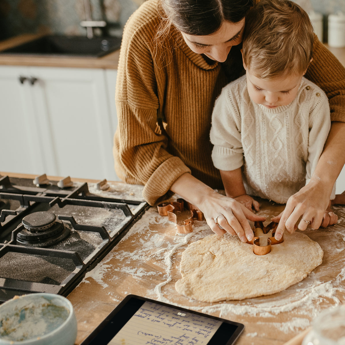 A family sharing their child’s artwork