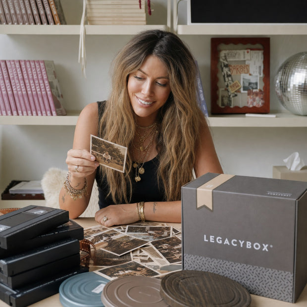 Chelsey Brown viewing old family photos with children