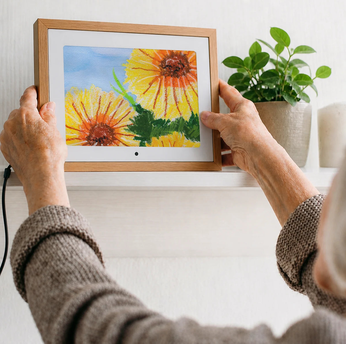A child’s drawing displayed in a digital frame