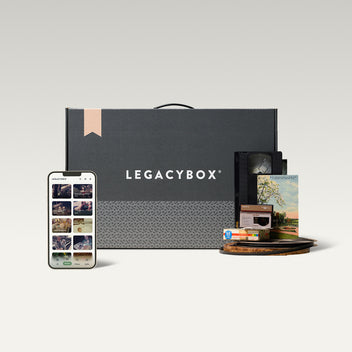 Legacybox with a phone and supported tapes, film, and photos